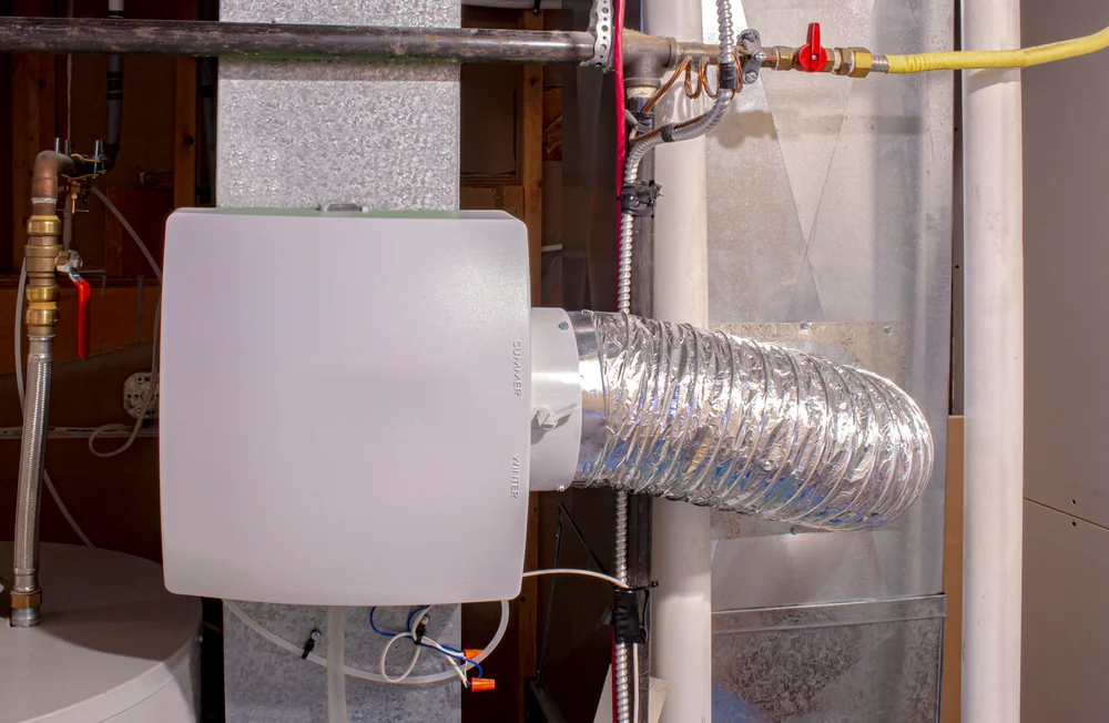 Whole-home humidifier mounted on HVAC duct — indoor air quality service near Lake Gaston