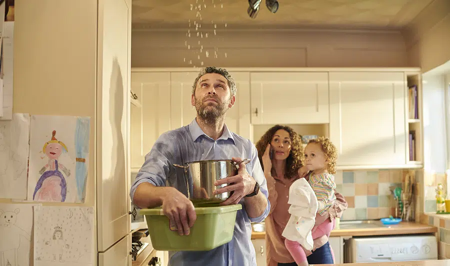 Family catches ceiling leak with pots — 24/7 emergency plumbing service in Lake Gaston Area