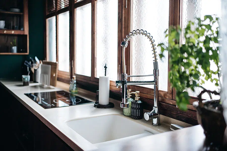 Stylish kitchen sink with spring-neck faucet — faucet installation and repair near Lake Gaston