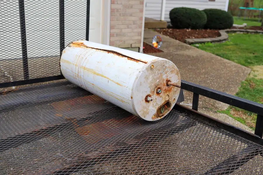 Rusty old water heater removed for disposal — water heater replacement service Lake Gaston Area
