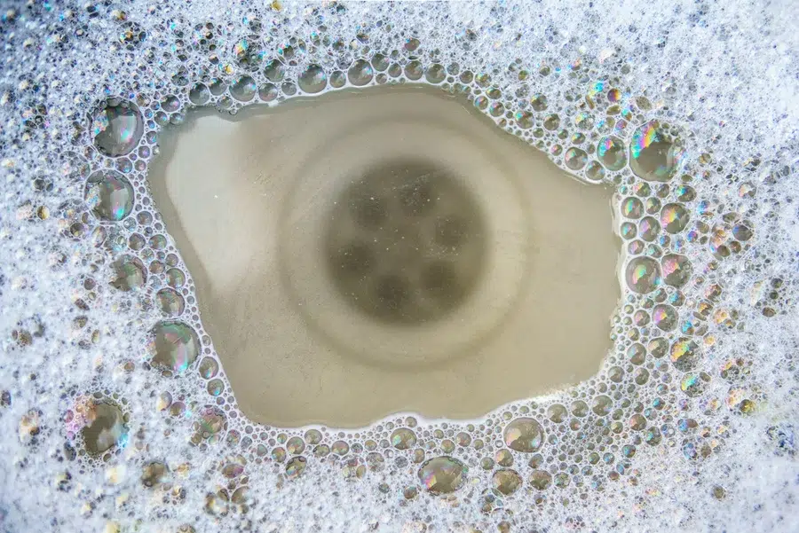 Soapy water barely draining from a slow sink — professional drain cleaning near Lake Gaston Area