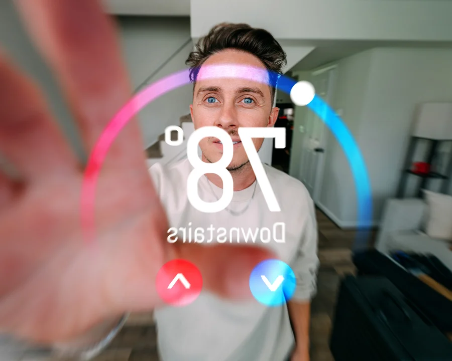 Man adjusting smart thermostat display showing 78 degrees — smart HVAC upgrades Lake Gaston Area
